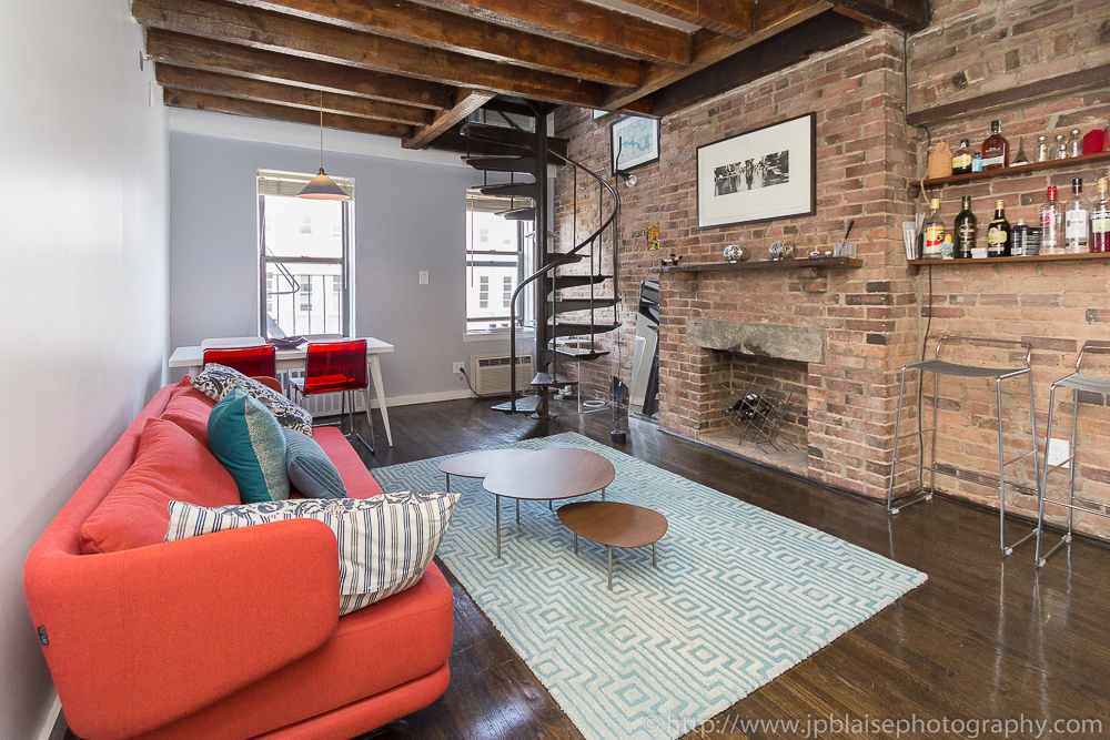Professional picture of the living room of a Beautiful East Village duplex One Bedroom apartment