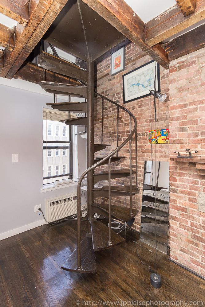 Staircase leading to top floor of One Bedroom apartment in the East Village of New York City