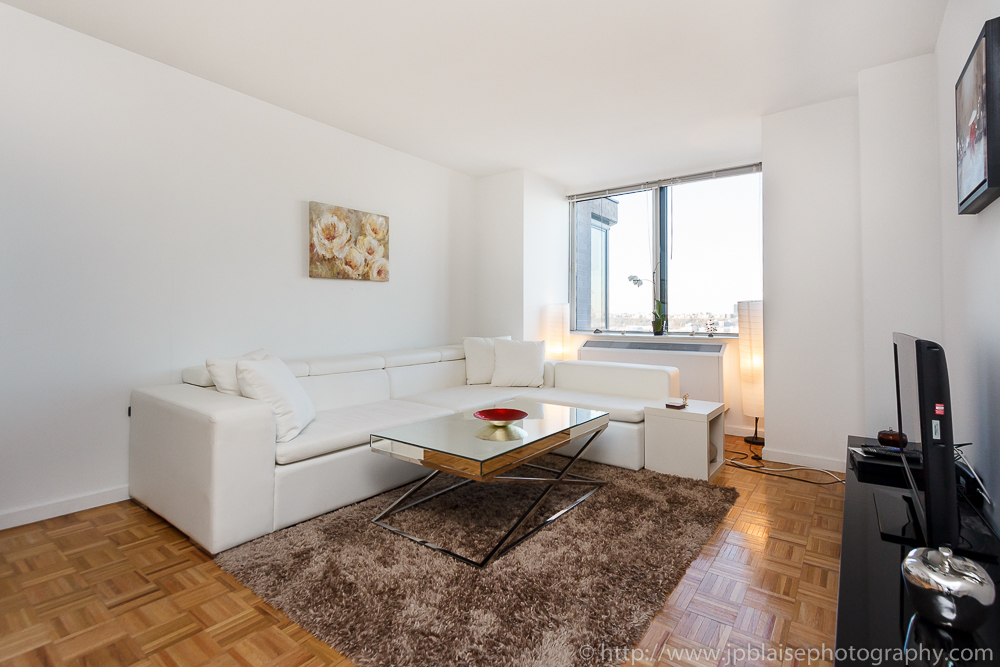 Apartment photography: white sofa of a one bedroom on the upper west side of manhattan new york city